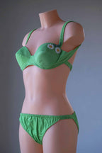 Side shot of green Vintage 60's Flower Bikini on mannequin