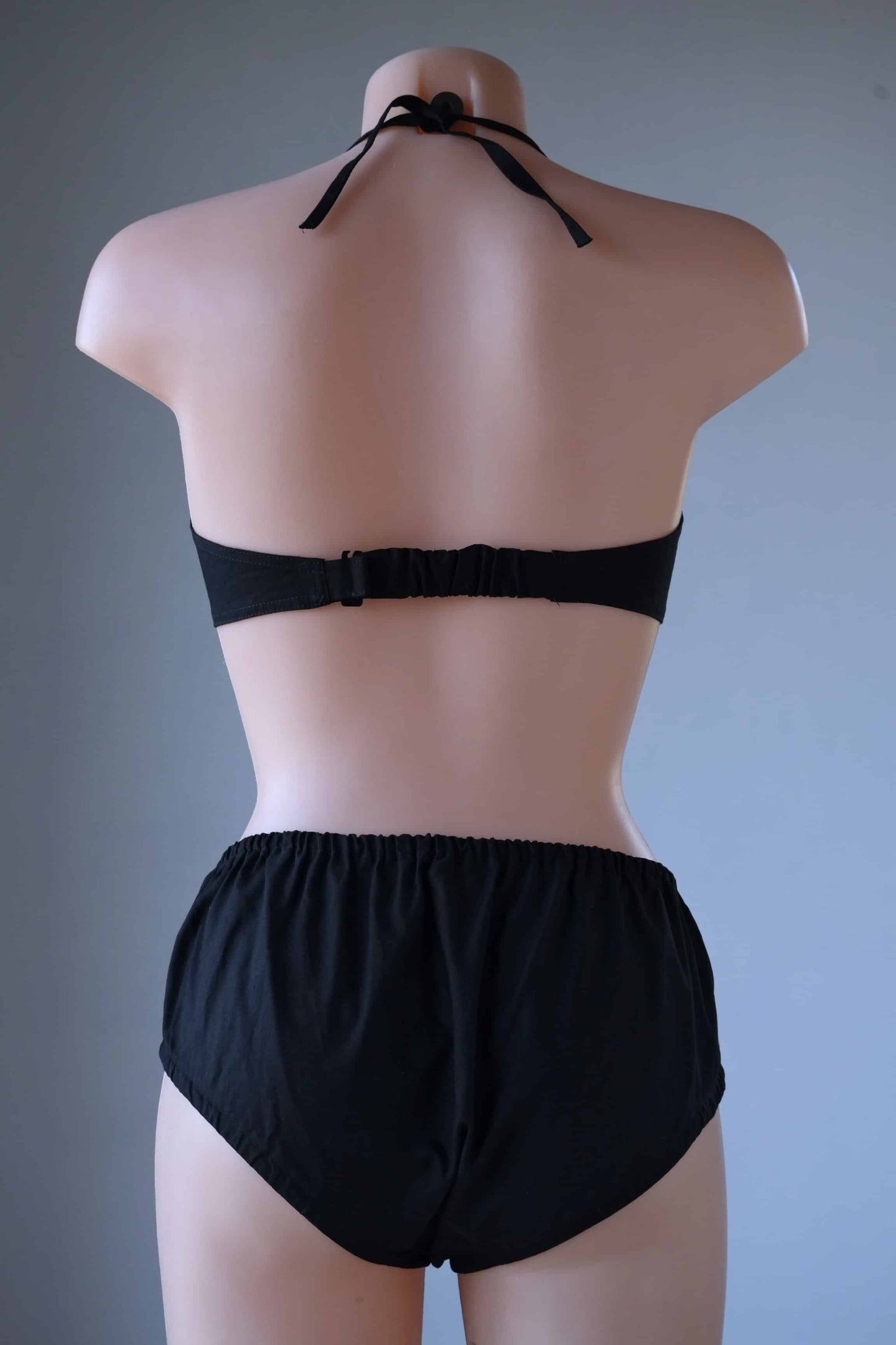 Back view Vintage Solid 60's Bikini in black worn on mannequin