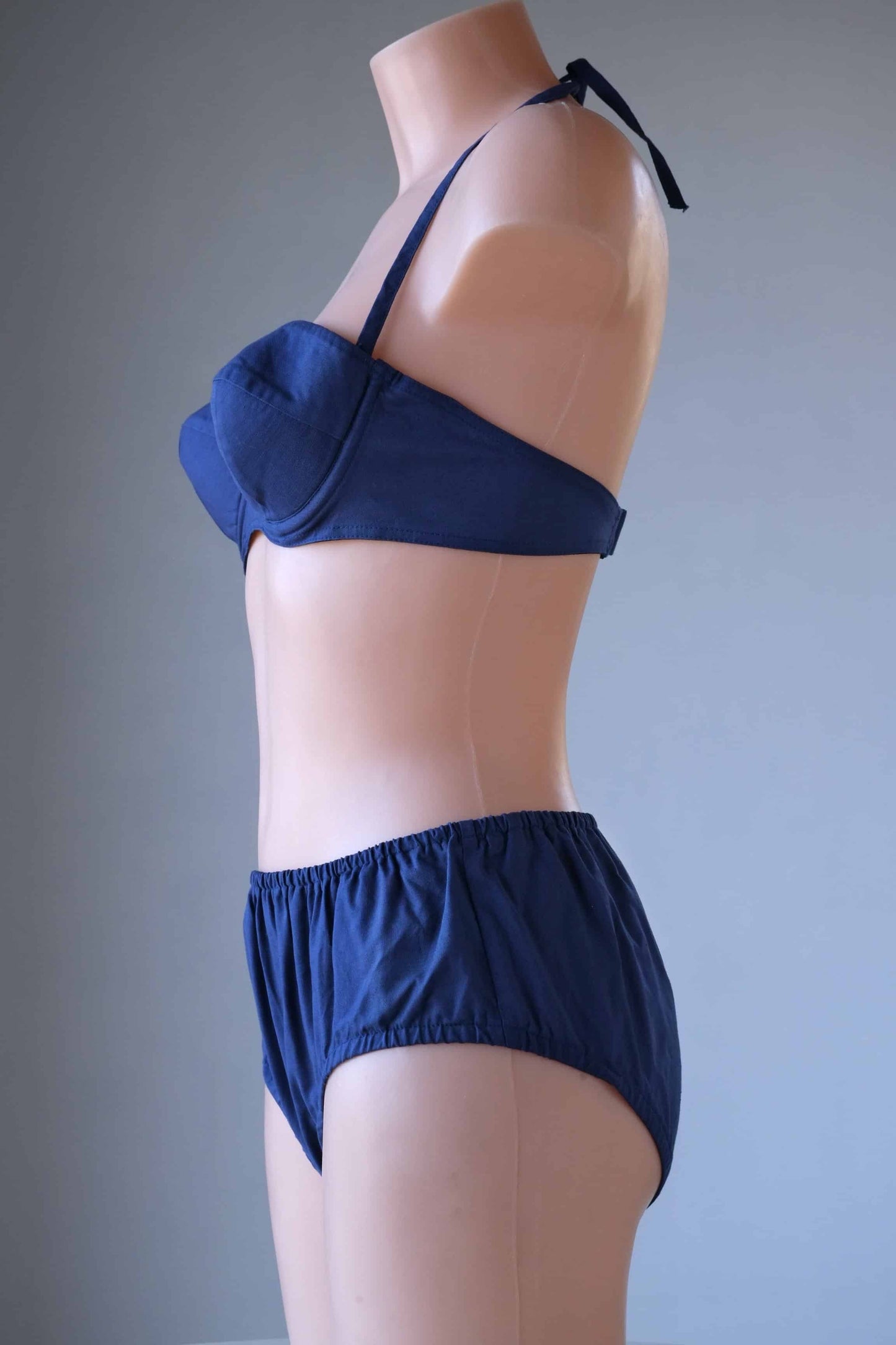 Side view Vintage Solid 60's Bikini in navy worn on mannequin