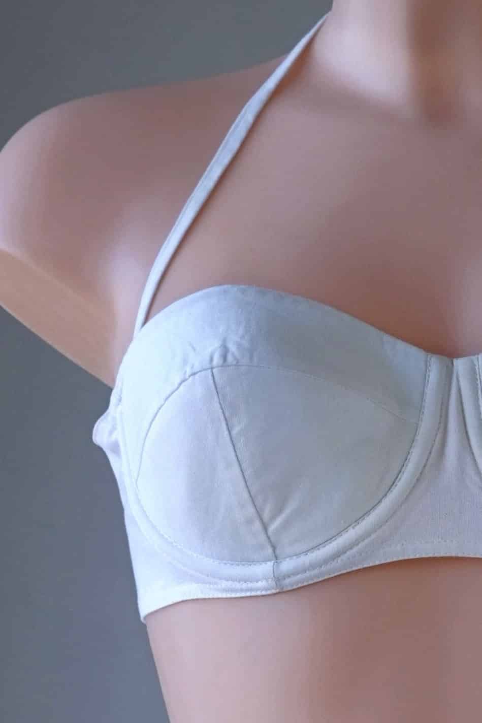 Close view Vintage Solid 60's Bikini in white worn on mannequin