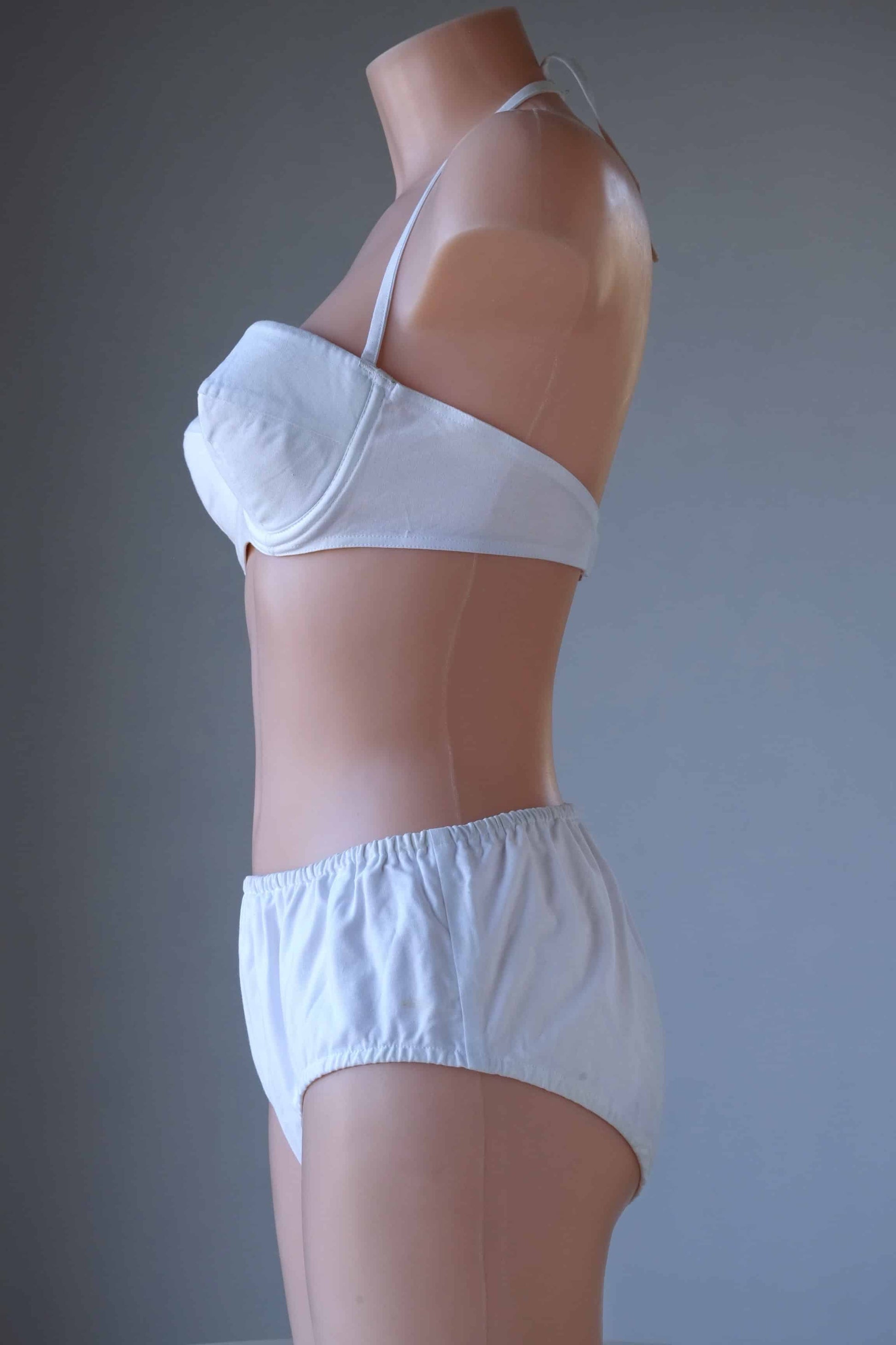 Side view Vintage Solid 60's Bikini in white worn on mannequin