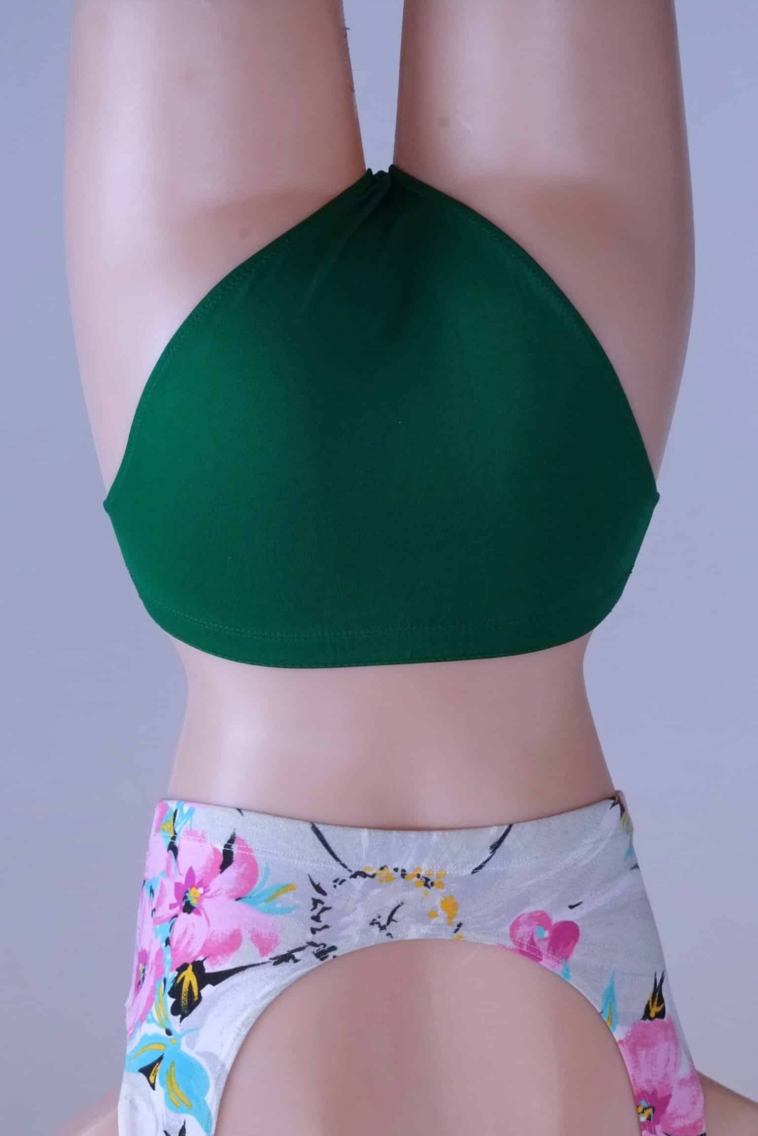 Back view of a mannequin wearing the vintage Danskin emerald green dance briefs.