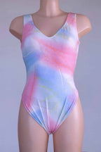 Front view of a vintage Danskin leotard with a tie-dye print on a mannequin.