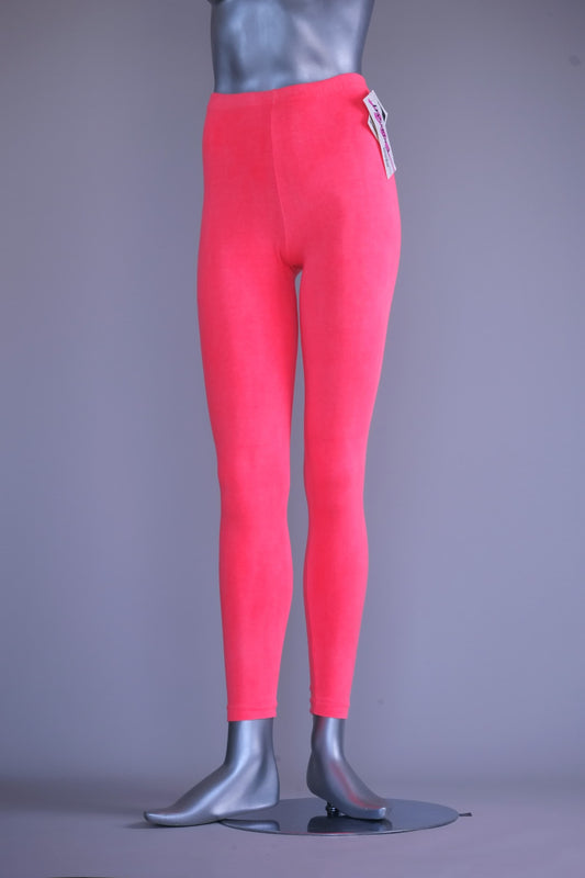 A mannequin wearing a pair of vintage 90s Danskin high-waist leggings in a washed-out coral pink color.