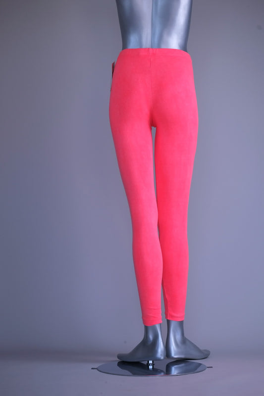 Back view of A mannequin wearing a pair of vintage 90s Danskin high-waist leggings in a washed-out coral pink color.