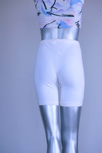 A pair of Vintage 90s white cotton biker shorts displayed on a silver mannequin, front view.