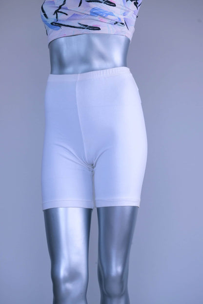 A pair of Vintage 90s white cotton biker shorts displayed on a silver mannequin, front view.