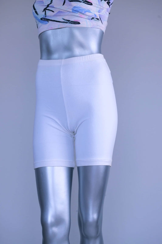 A pair of Vintage 90s white cotton biker shorts displayed on a silver mannequin, front view.