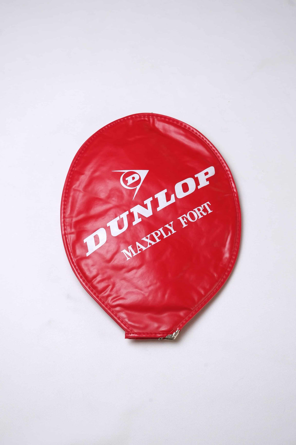 Red vintage vinyl Dunlop Maxply Fort tennis racket head cover with white branding and zipper enclosure, isolated on a white background.