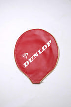 Classic red vinyl Dunlop vintage tennis racket cover with a gold-trimmed zipper and diagonal white logo lettering.