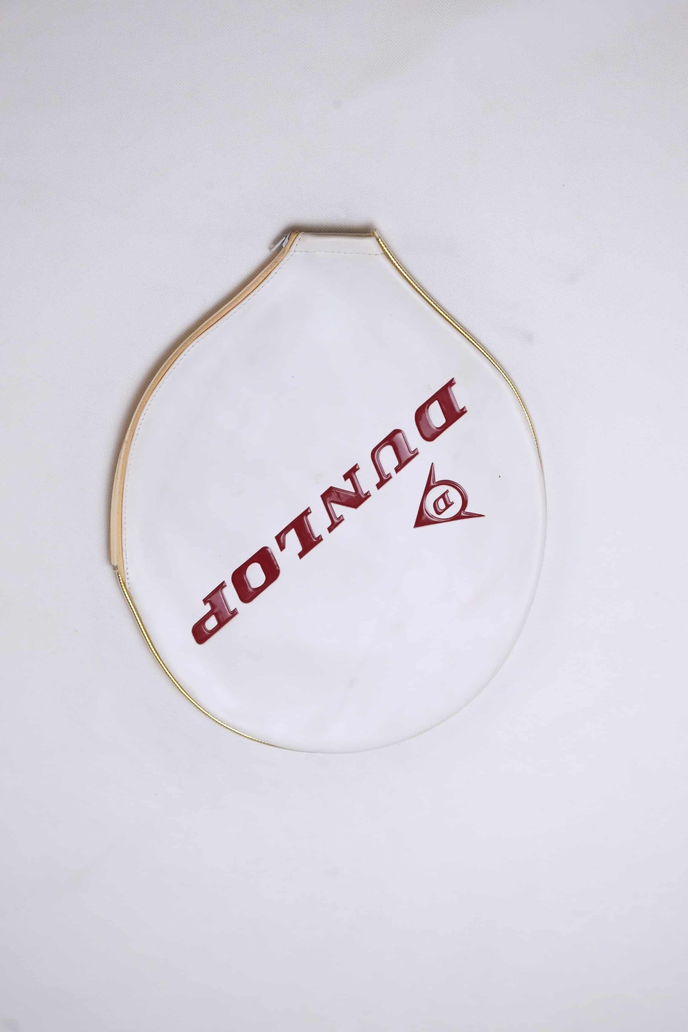 Classic white vinyl Dunlop vintage tennis racket cover with a gold-trimmed zipper and diagonal white logo lettering.