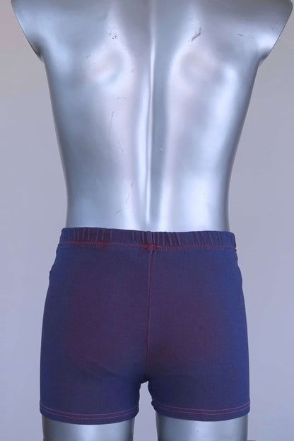 Back view of vintage 90s Ellesse men’s swim trunks in purple ribbed fabric, displayed on mannequin.