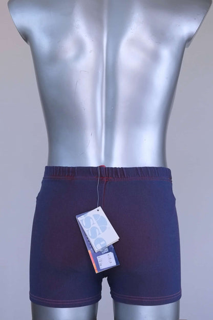 Back view of vintage Ellesse swim trunks showing original paper tags attached at waistband.