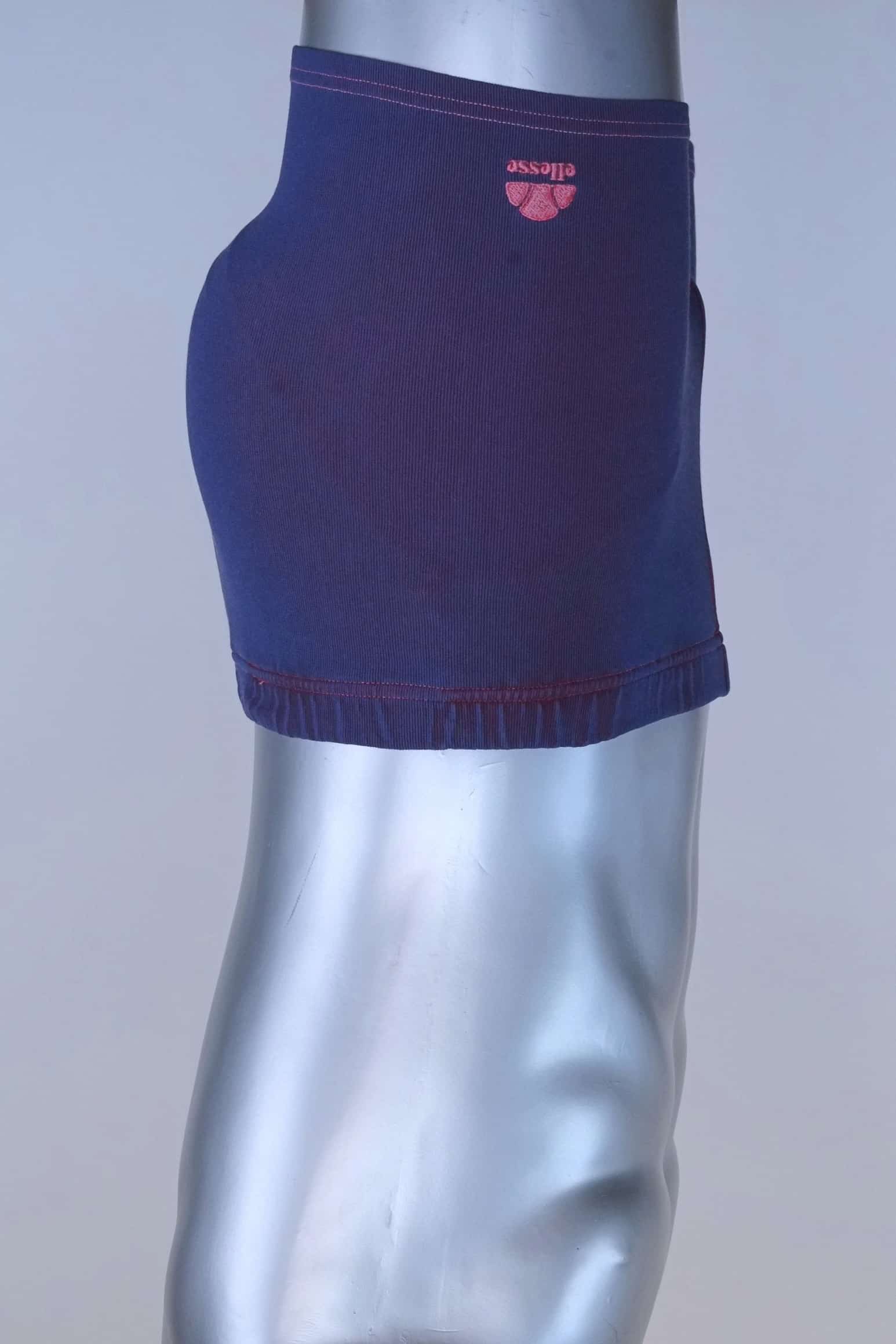 Side profile of vintage 90s Ellesse men’s swim trunks with embroidered pink logo at hem.