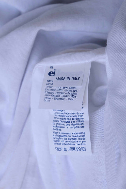 A close-up of a white clothing label with the text 'Made in Italy,' care instructions in multiple languages, and fabric content details.
