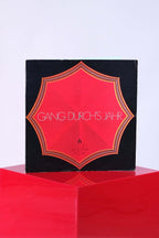 Front cover of 1972 Fischer “Gang Durch’s Jahr” vinyl with bold red umbrella design.