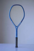 Vintage Fischer Superform Jo Durie tennis racket. The racket has a blue frame with white accents and a black handle. The strings are yellow. The word "FISCHER" is written in white on the frame.