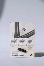 Back view of the vintage Fischer Vibrastop packaging, displaying illustrated step-by-step installation instructions for the racquet dampener.