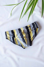 JACKY PEER Vintage black, grey and yellow Striped Swim Briefs displayed on white background.