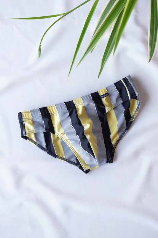 JACKY PEER Vintage black, grey and yellow Striped Swim Briefs displayed on white background.