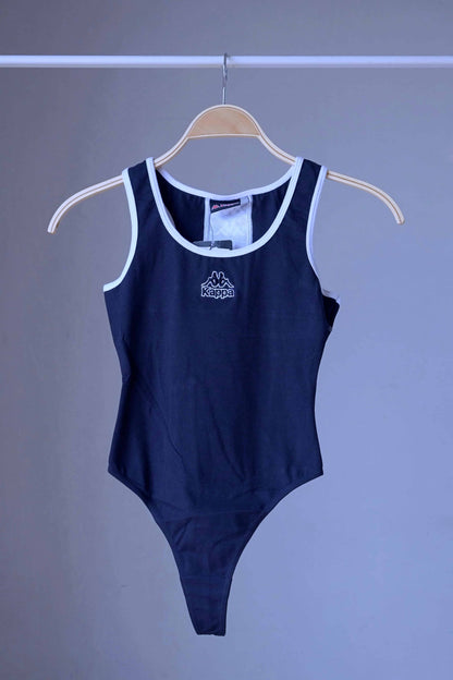 Front view of a navy KAPPA vintage 90s women's activewear leotard with white trim and a chest logo, displayed on a wooden hanger.