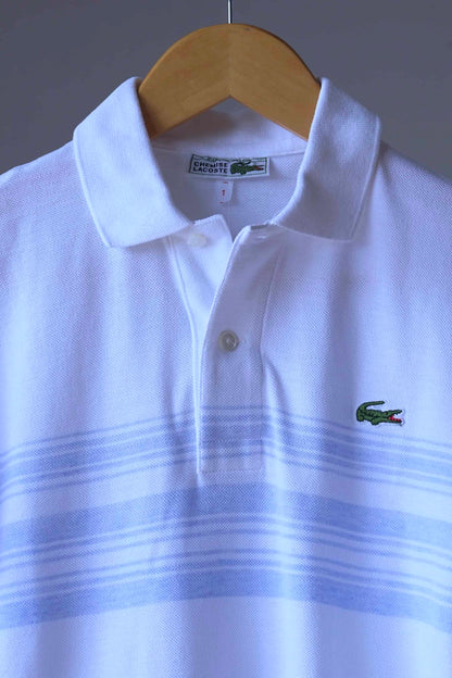 Close up of LACOSTE 80's Polo Shirt in white with subtle light blue stripes