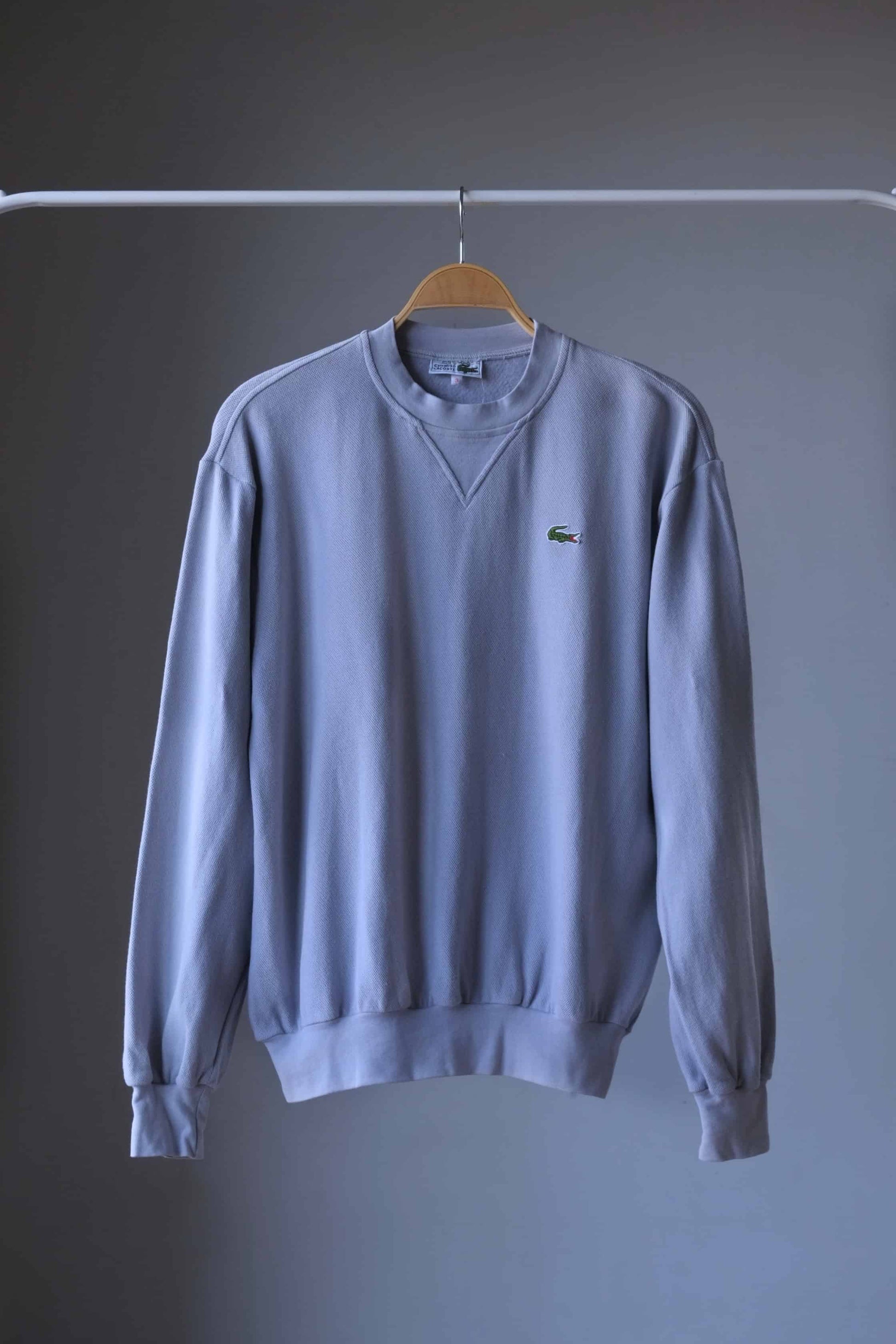 Gray Lacoste 90s sweatshirt on hanger