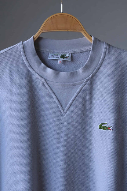 close up of Gray Lacoste 90s sweatshirt on hanger