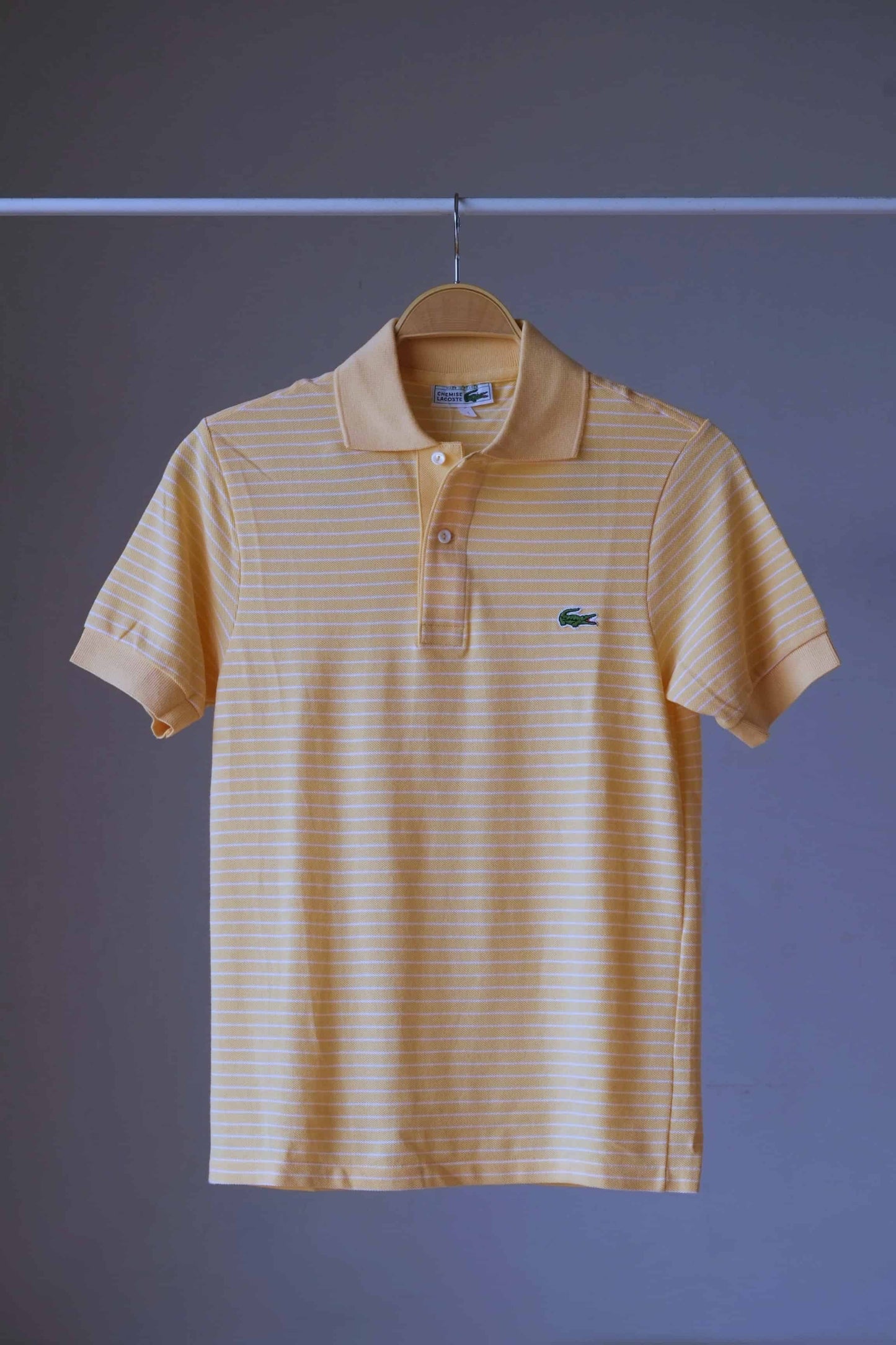 LACOSTE Striped Polo in melon color on hanger