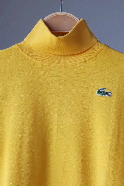 close up of yellow LACOSTE Turtleneck on hanger
