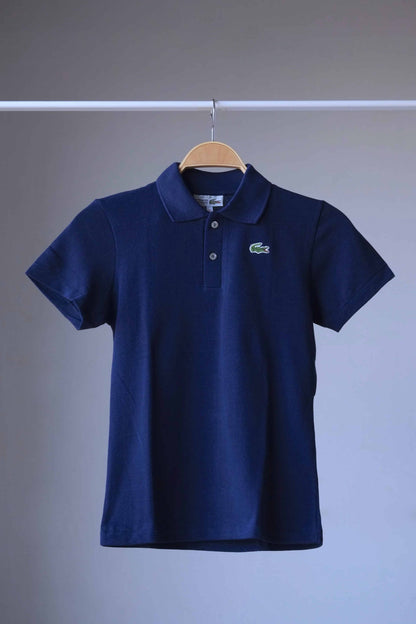 LACOSTE Vintage Polo Shirt in navy color on hanger