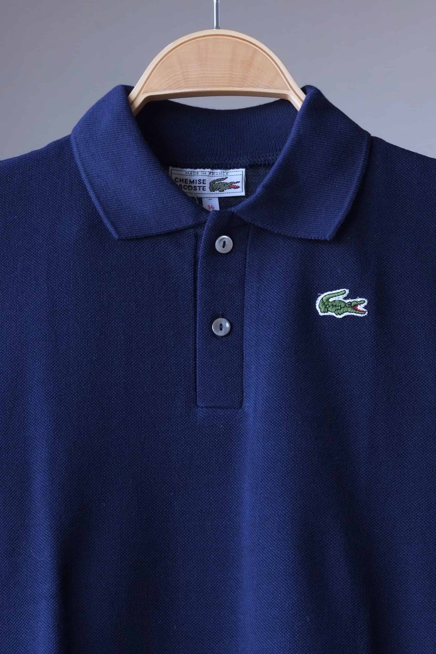 close up of LACOSTE Vintage Polo Shirt on hanger