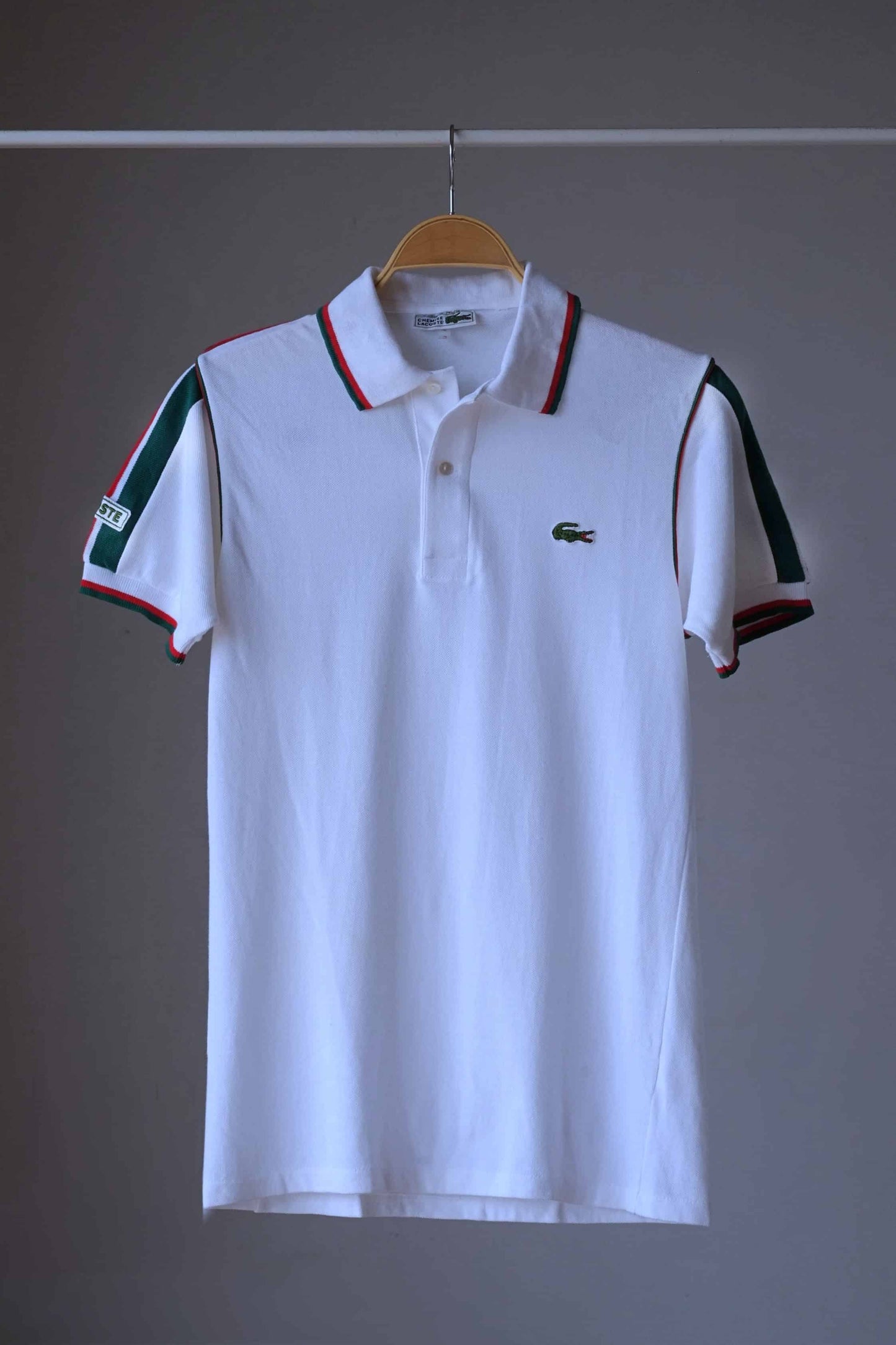 Lacoste vintage shirt in white and green stripes on hanger