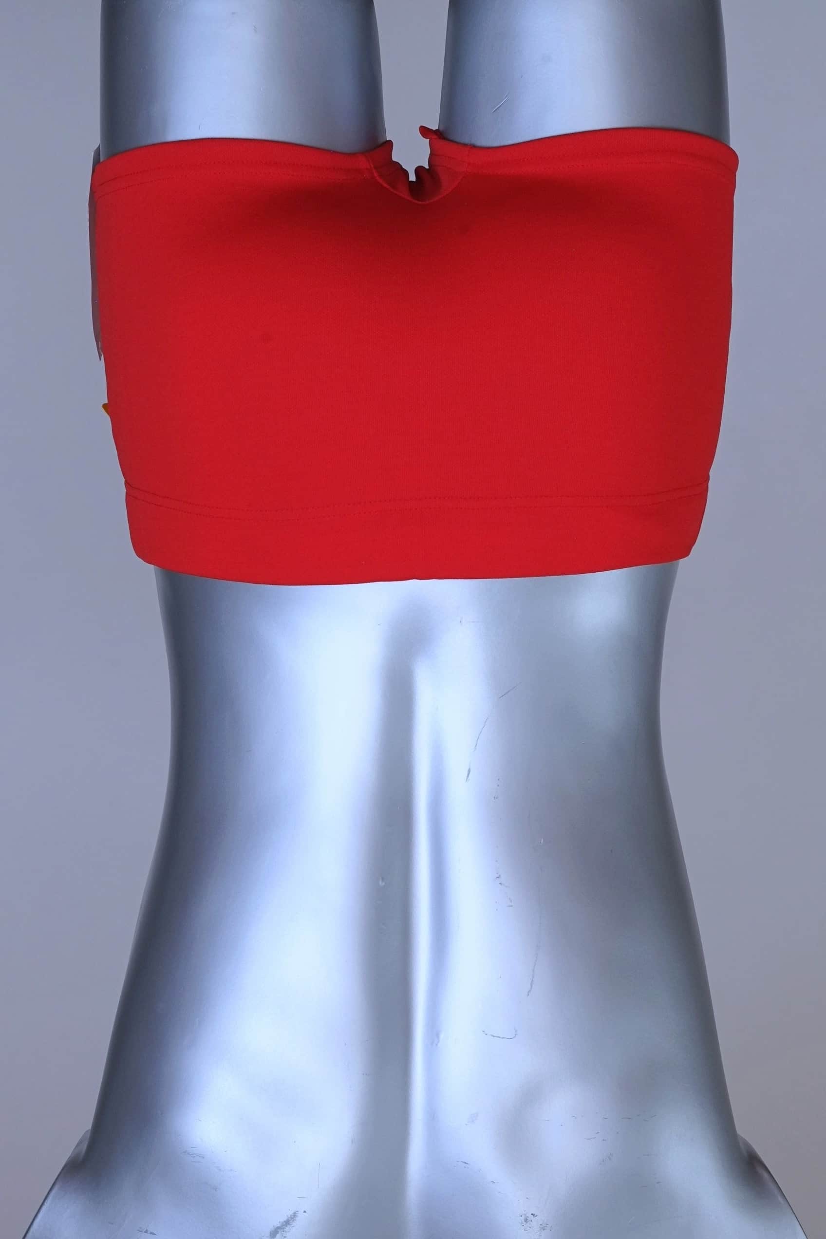 Back view of red Lahco vintage 60s swim trunks (Mataro model) on silver mannequin, showing zip pocket and snap waistband.