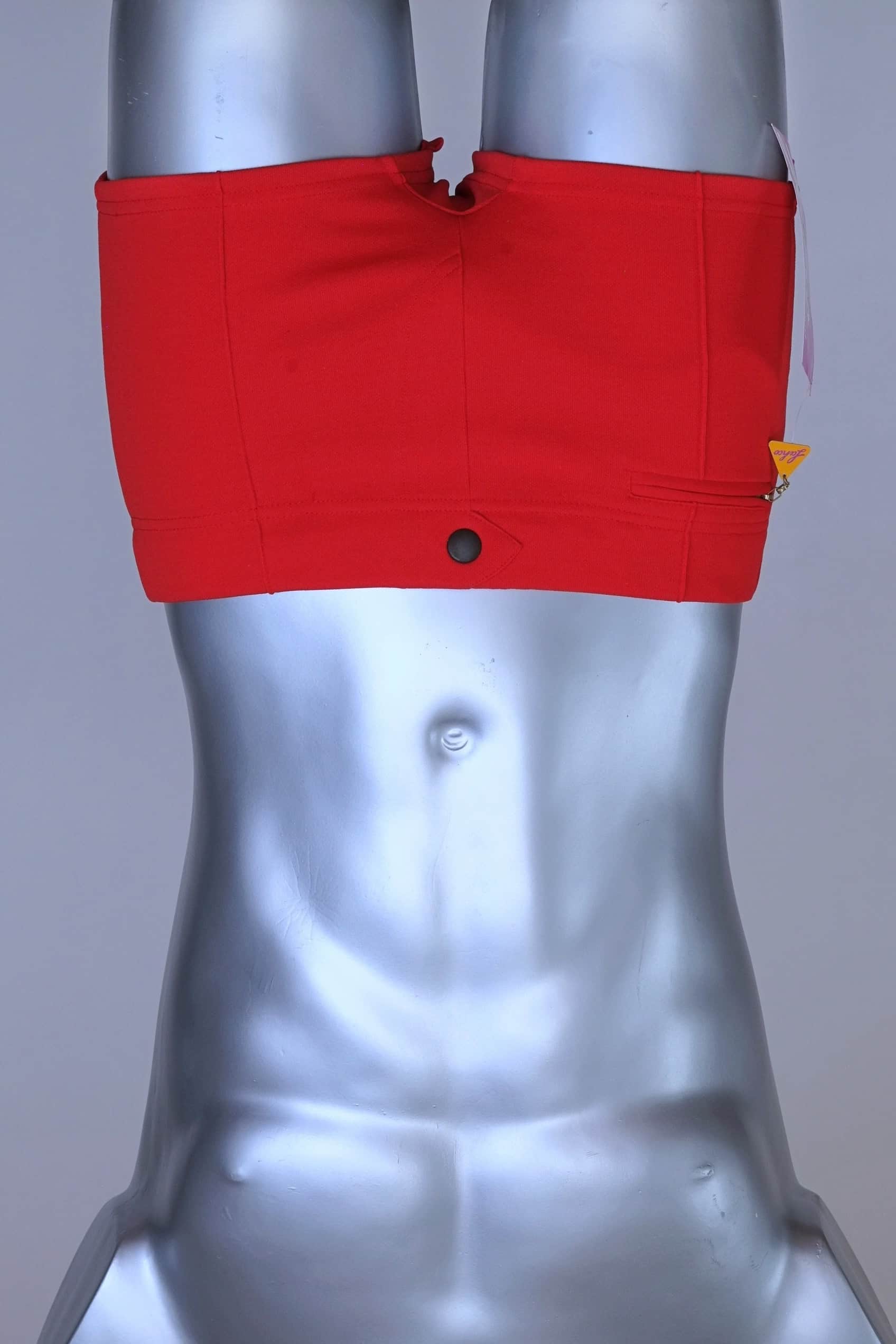 Front view of red Lahco vintage 60s swim trunks (Mataro model) on silver mannequin, showing zip pocket and snap waistband.