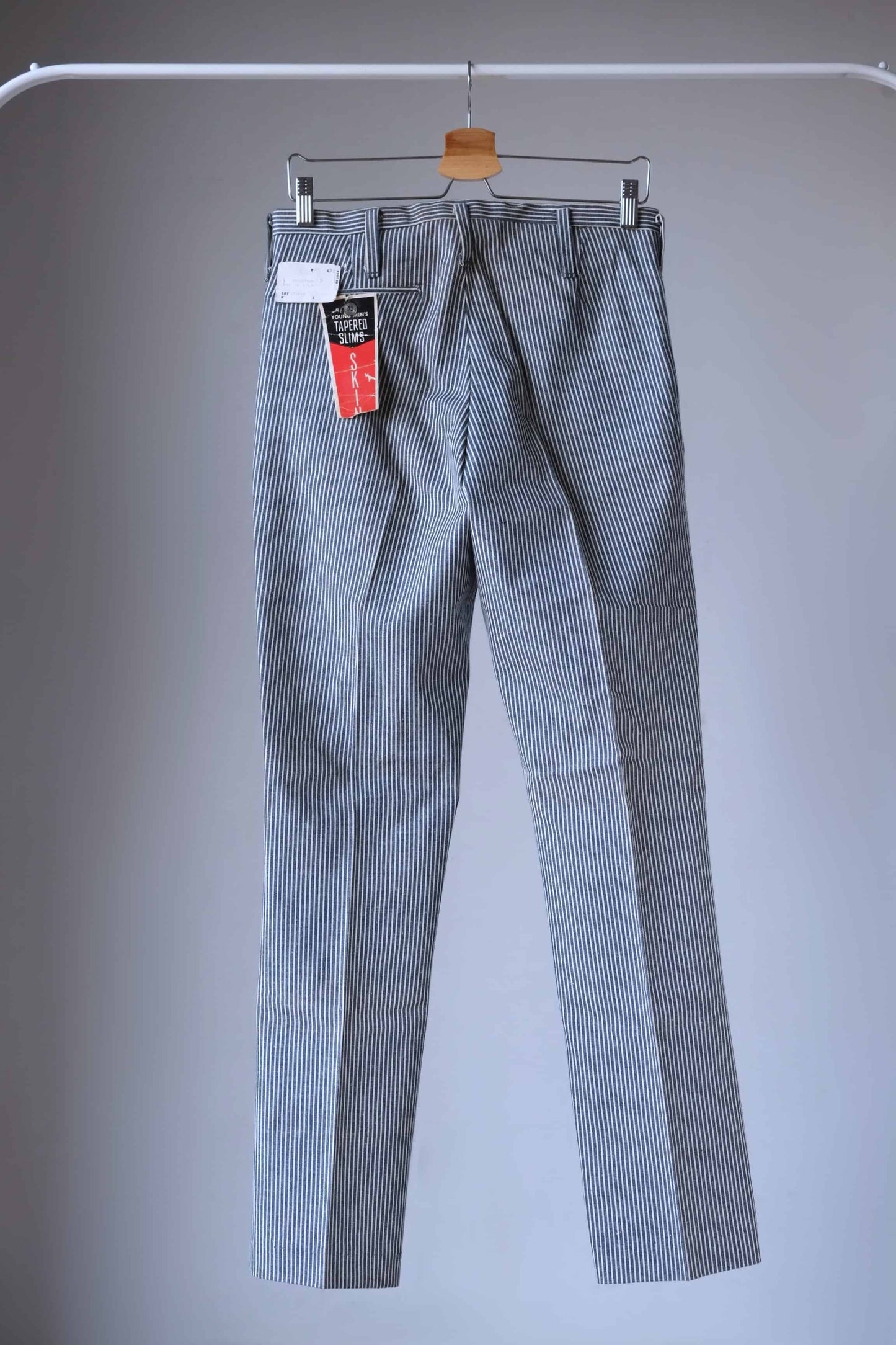 Back view of LEE 60's Vintage Tapered Slim Pants black and white stripes, on hanger