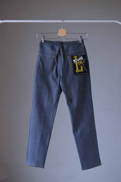 Back view of a pair of Vintage Lee lastic stretch denim jeans on hanger