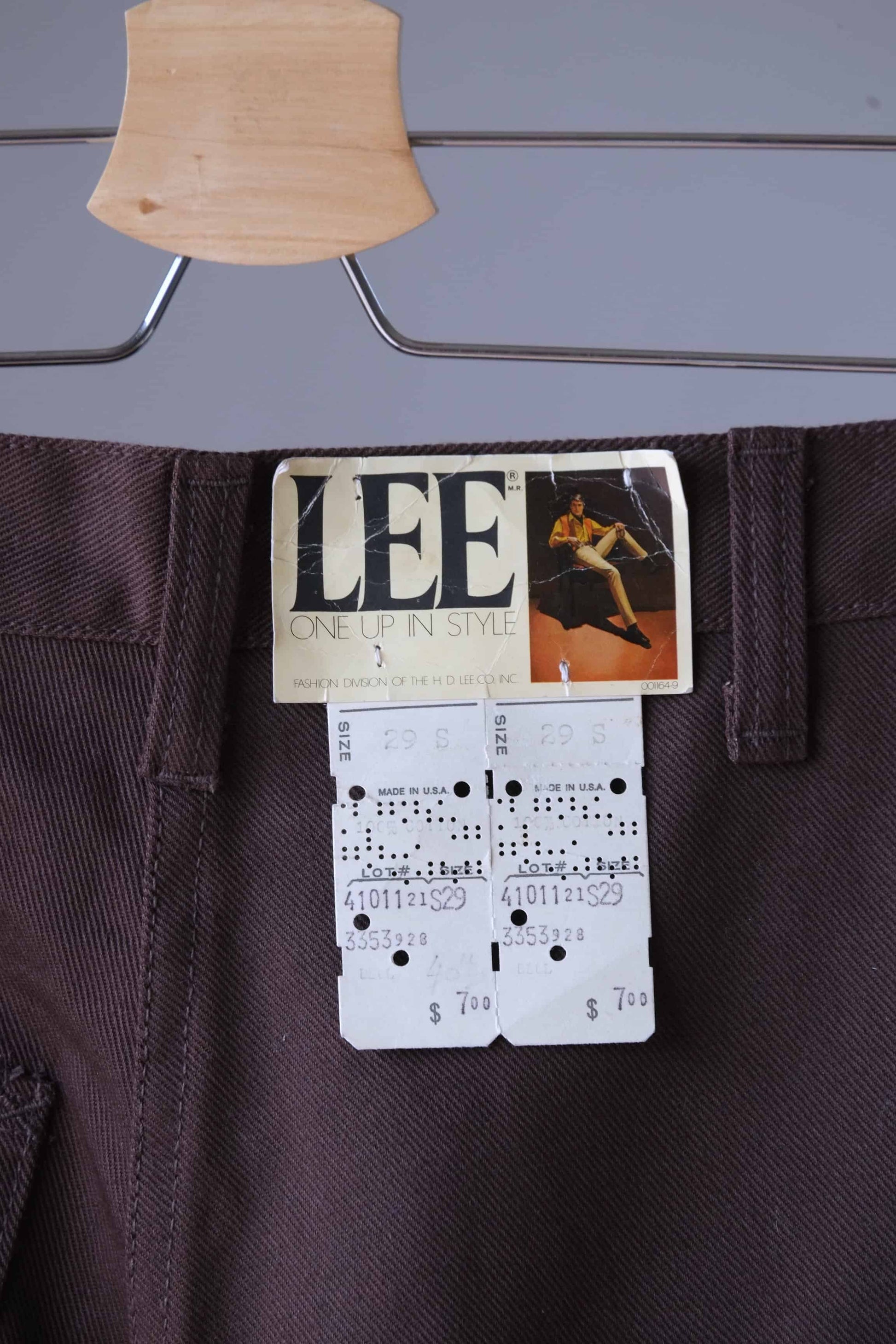 Close view of the Lee tag on the back of a pair of vintage brown pants