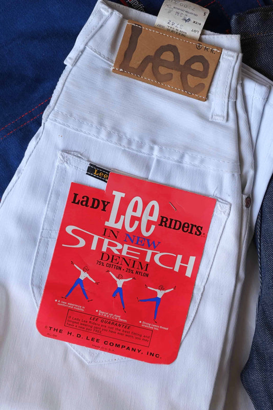 Folded pair of White LEE Vintage Stretch Riders Jeans