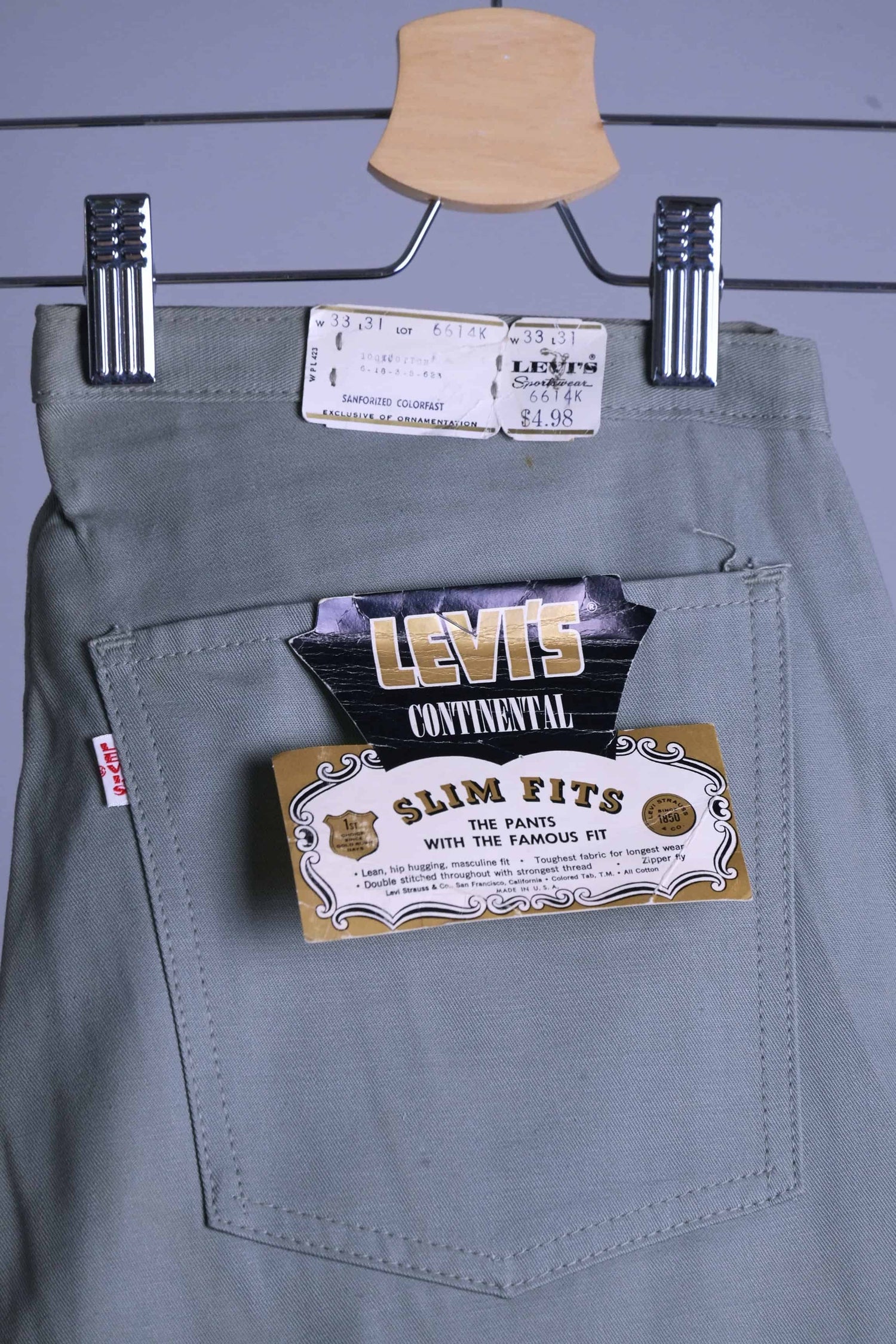 Close-up shot of the back pocket of the Deadstock Levi's Continental Slim Fit Chinos showing the original paper tag, Big E red tab, and lot number 6614K.