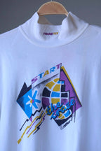 Close-up of the mock neck collar with yellow and purple Transtex embroidery above the yellow, blue and purple “Start the Craze” graphic