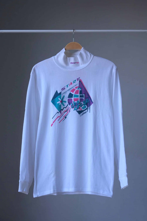 Front view of white Löffler 90s mock neck long-sleeve tennis top with a pink, teal and purple “Start the Craze” graphic and Transtex collar embroidery