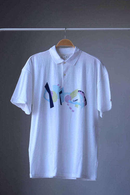 Vintage 90s Löffler men’s white tennis polo with a Memphis print in navy, sky blue, sage and lilac across the chest