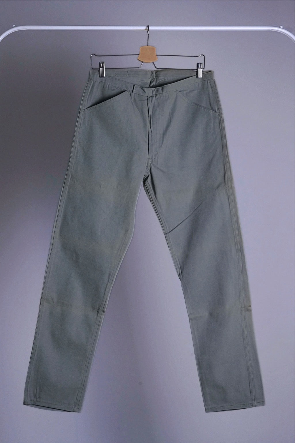 Full front view of the Deadstock Levi's Continental Trim Fit Chinos in sage green color, hanging straight.