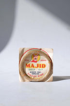 Deadstock vintage Majid Dog Brand natural sheep gut tennis strings in their original paper packaging from Sialkot, West Pakistan.