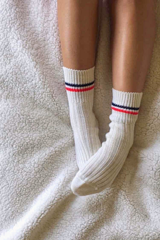 Vintage off-white wool socks with red and navy stripes worn by model