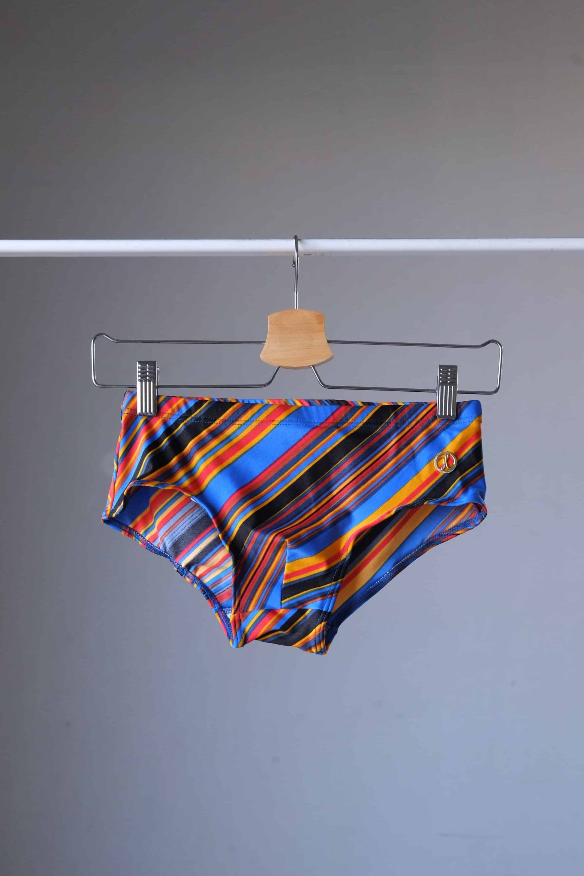 MONSIEUR ORCHIDÉE Vintage 80's Men's Swim Briefs: Retro Striped Swimwear, blue colorway, on hanger