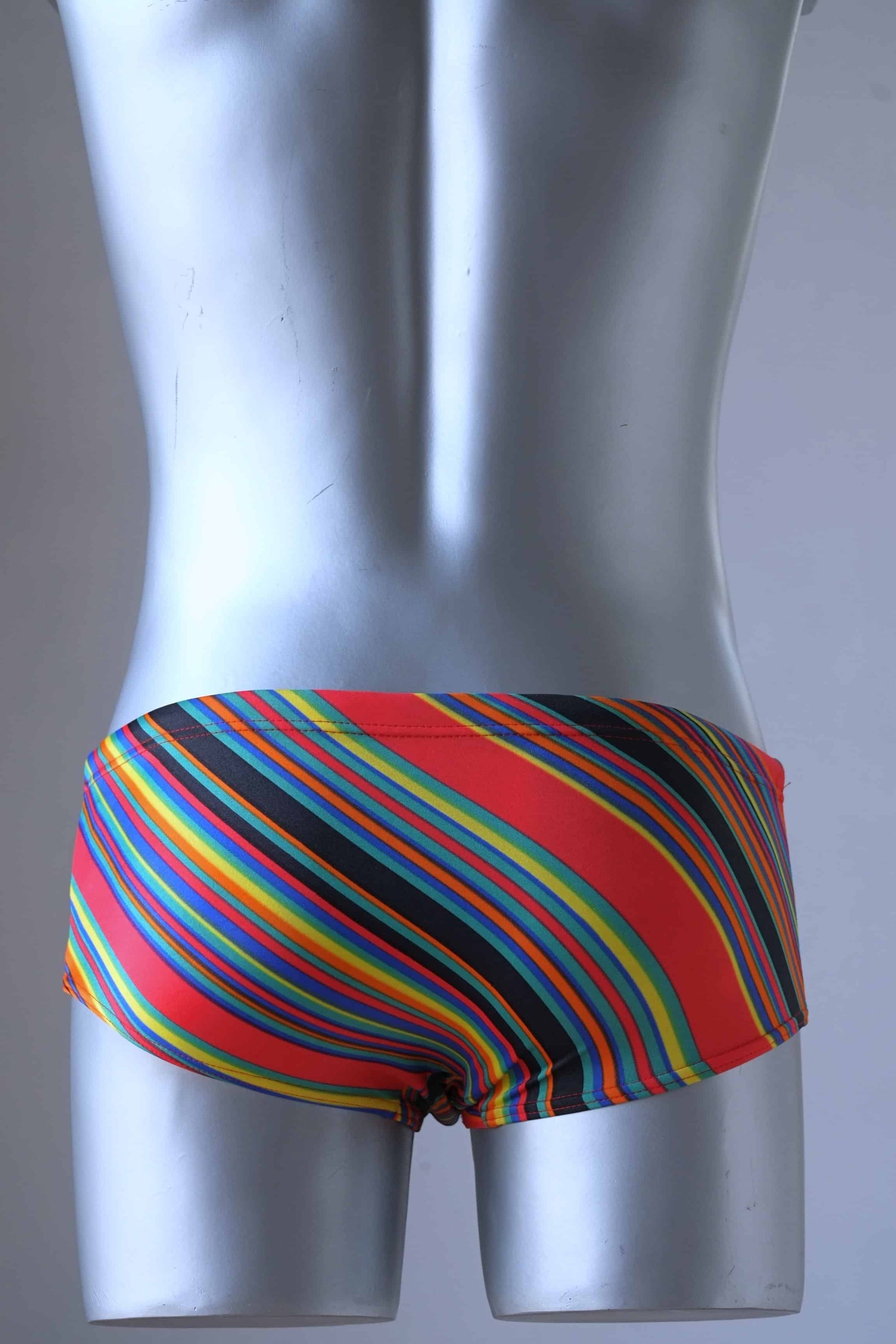 Backside of MONSIEUR ORCHIDÉE Vintage 80's Men's Swim Briefs: Retro Striped Swimwear, color red.