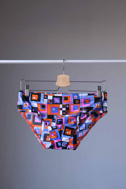 Vintage 80's Retro Geometric Square Swim Briefs in blue/pink on hanger