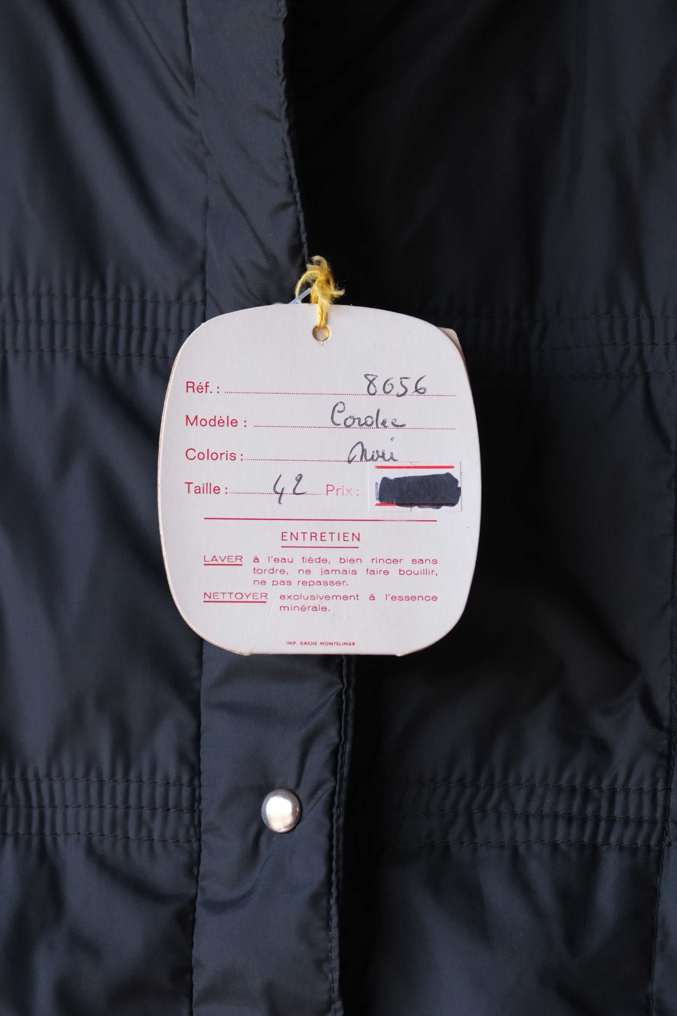 Close up of the original hangtags  of the Mossant jacket. The tag lists the model as "Cordée," the color as "Noir" (Black), and the size as 42, with French care instructions printed below.